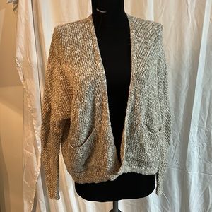 Tan and white woman’s cardigan